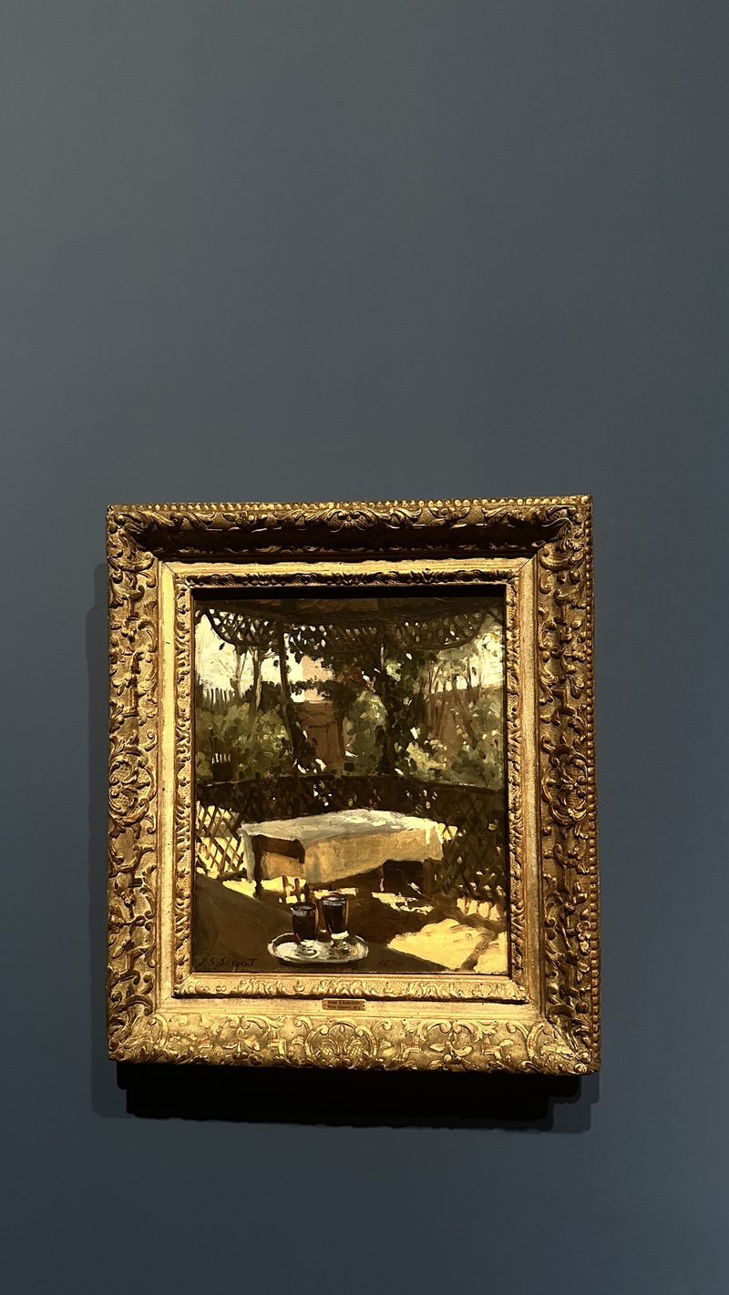 A small painting in a heavy gilt frame