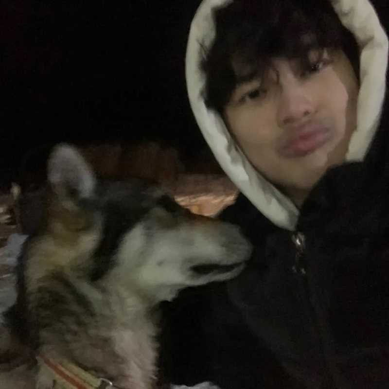 Ryan Li with a dog